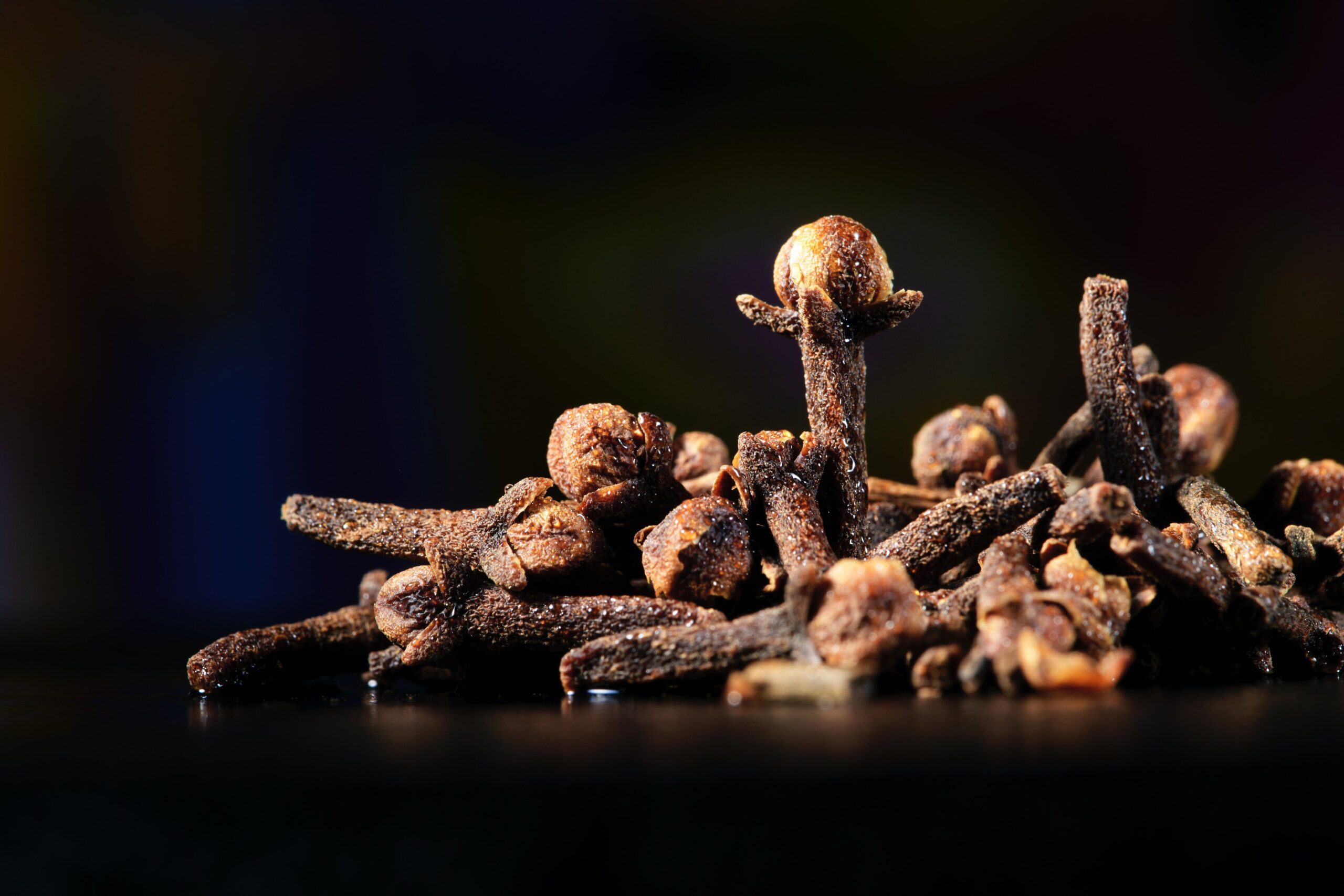 Dried cloves on black background