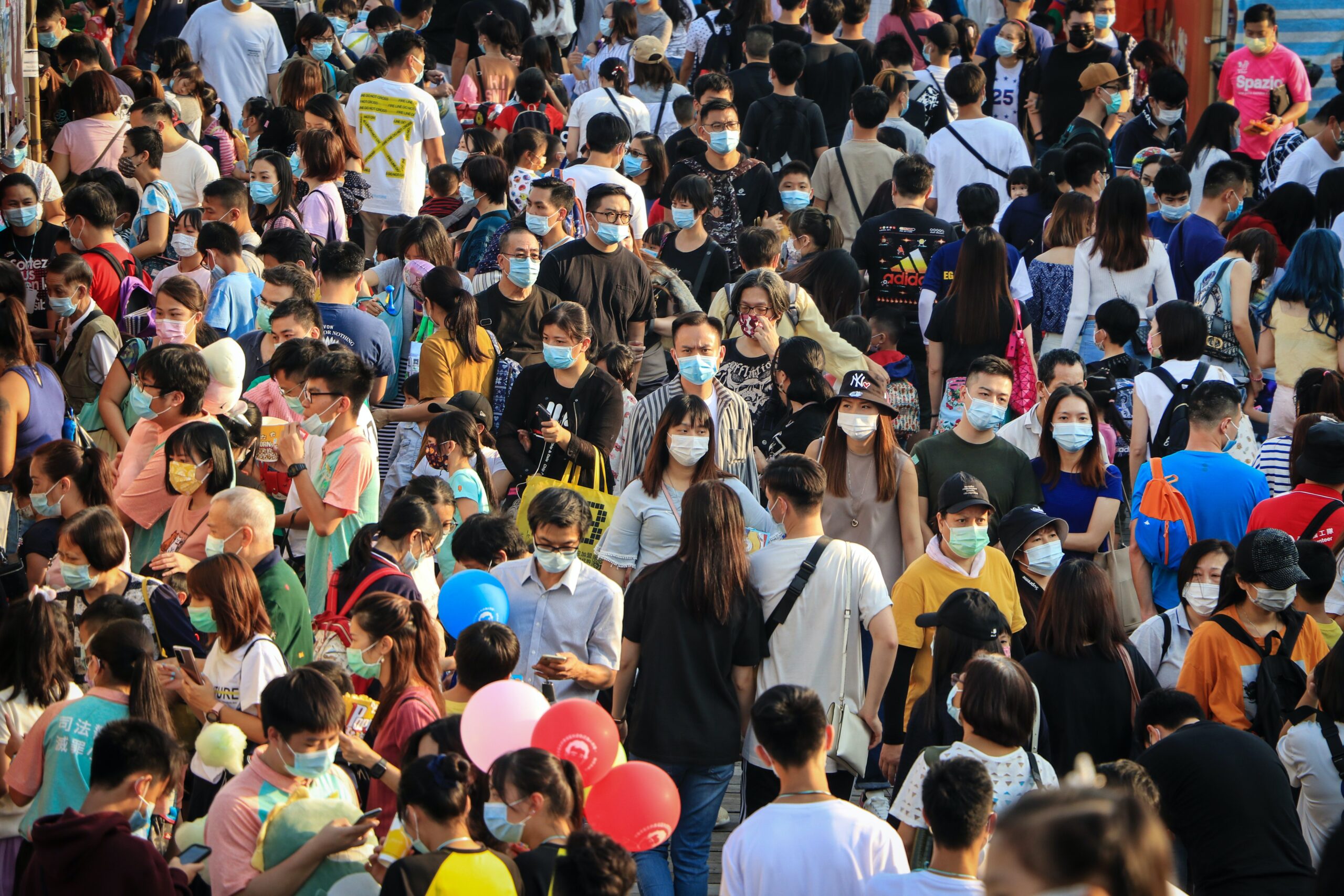 wei qi. Large crowd of masked people