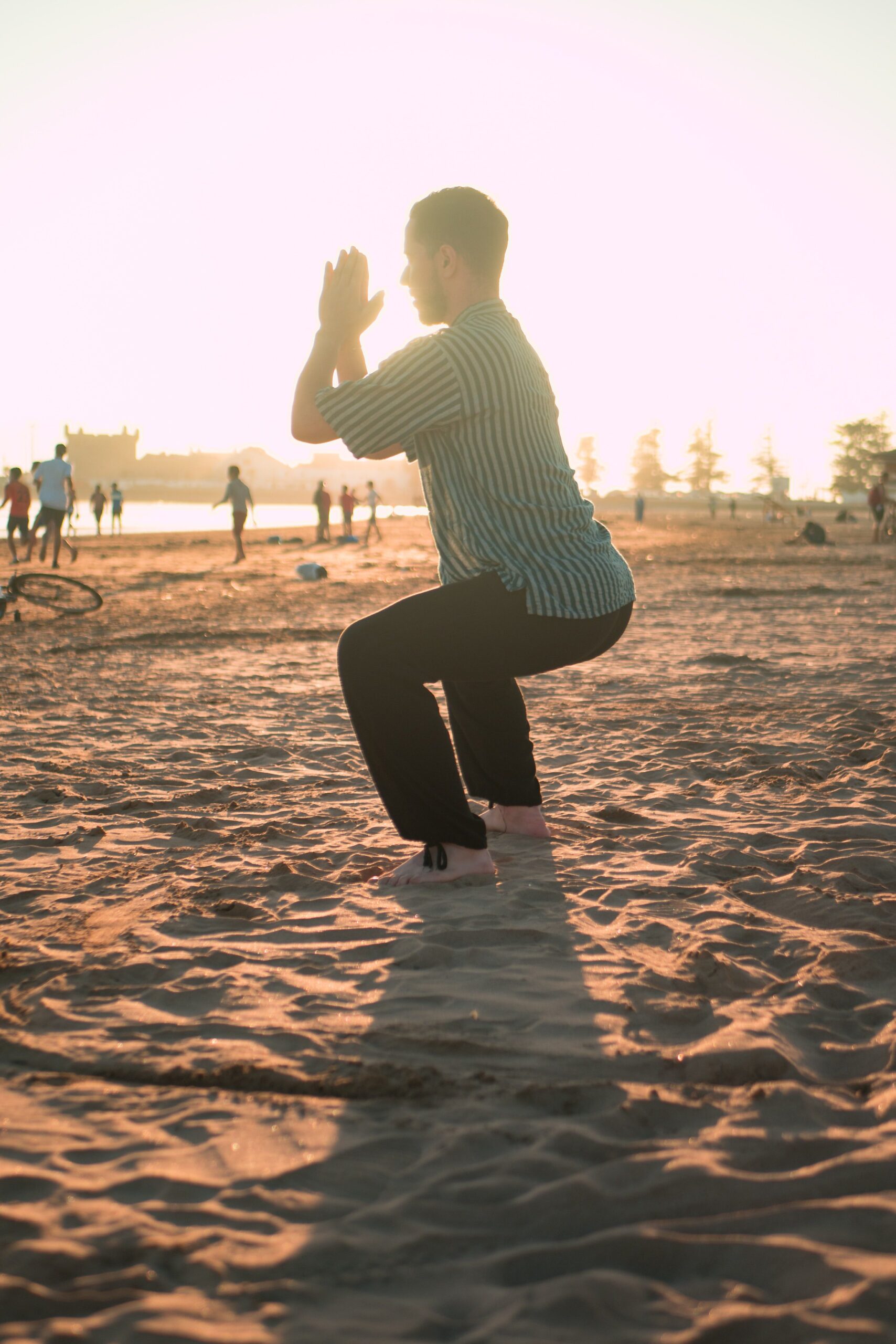 Meditating on sandy beach